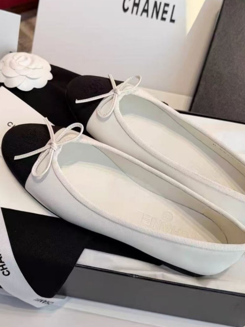 CHANEL Black White Cap‑Toe Bow Ballet Flats